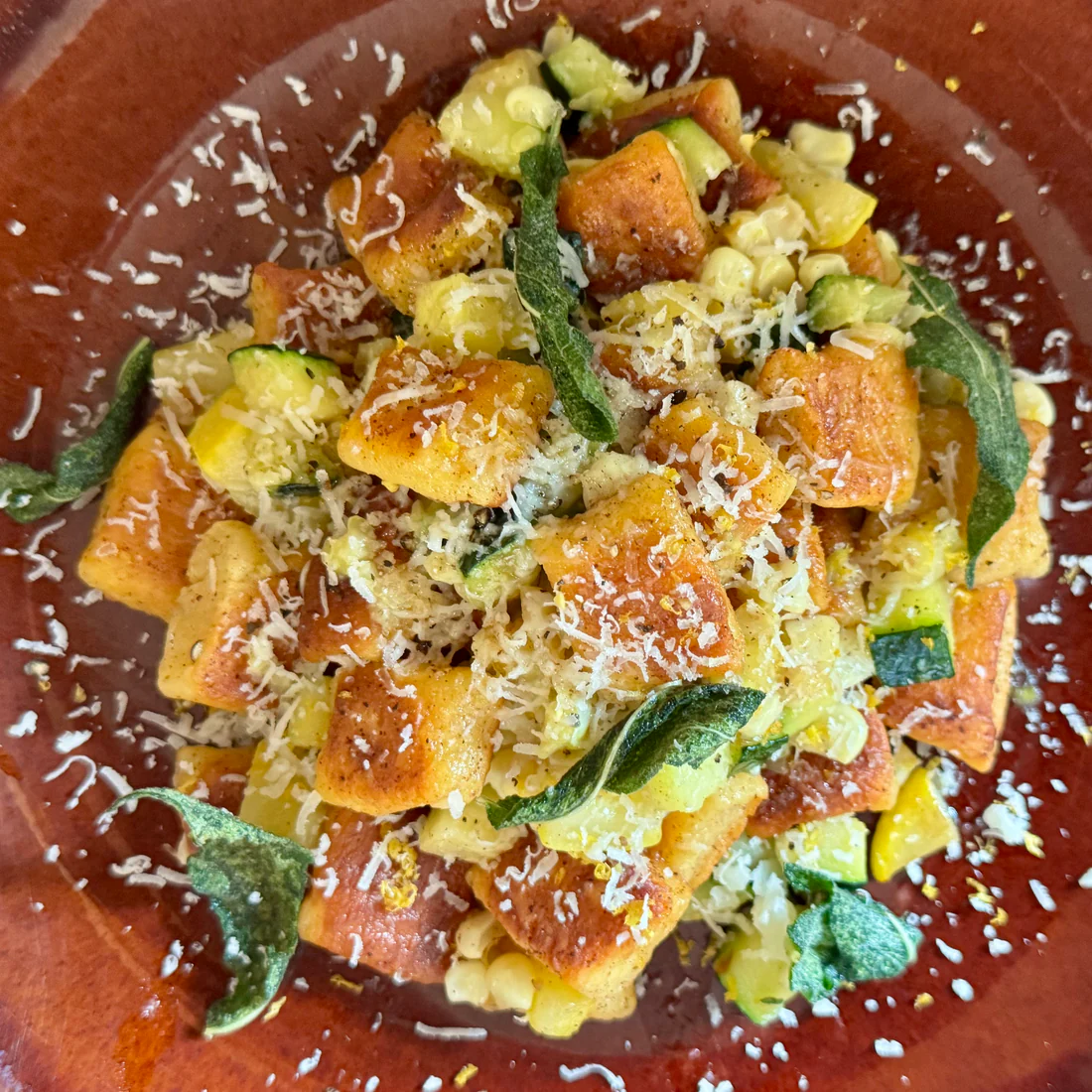 Summer gnocchi with corn, zucchini, sage, and grated cheese